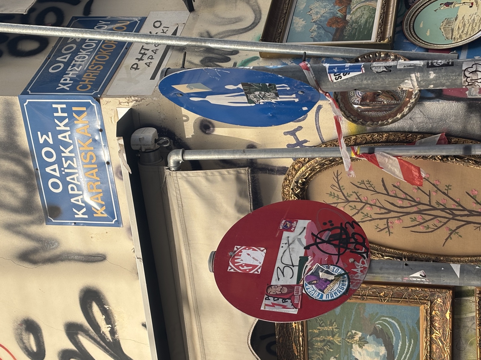 Exarcheia: street signs, paste-ups and an open-air antiques market