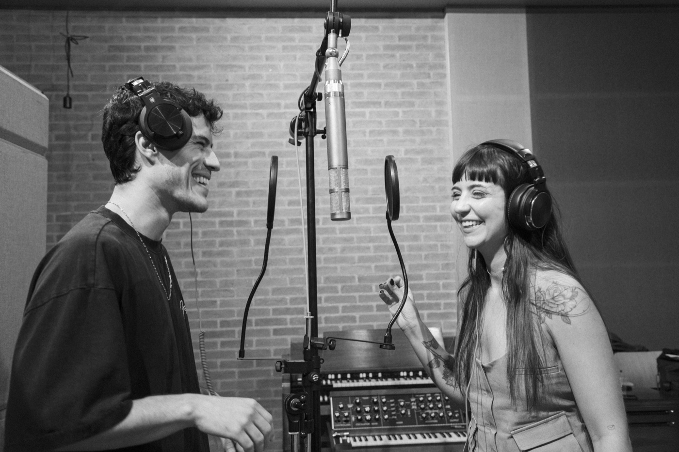 Luís and Dora at the mic